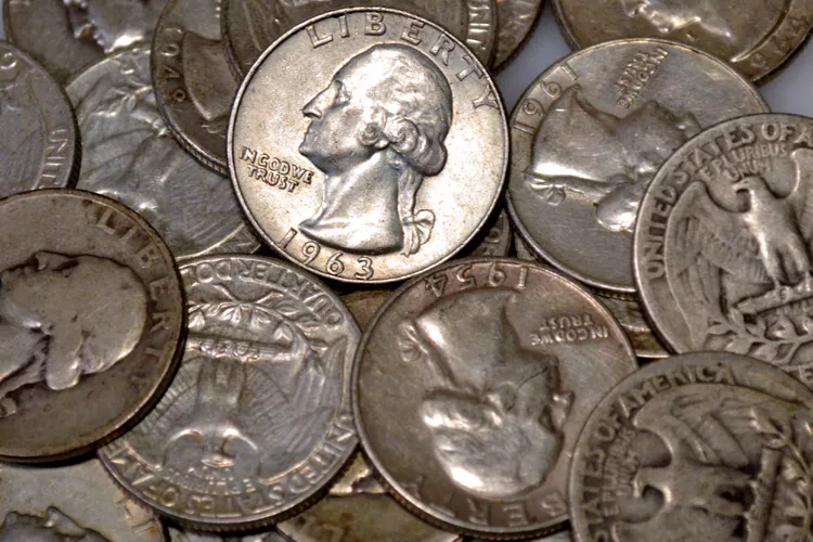 Stack of US quarters ready for the coin operated washers and dryers at Retro Laundry Co.